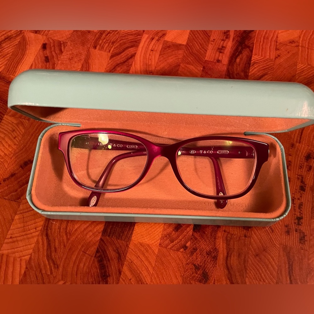 Tiffany & Co. plum red eyeglasses for frames only as lenses are prescription.